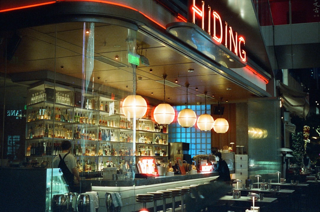 Modern bar interior with glowing lights and bottles
