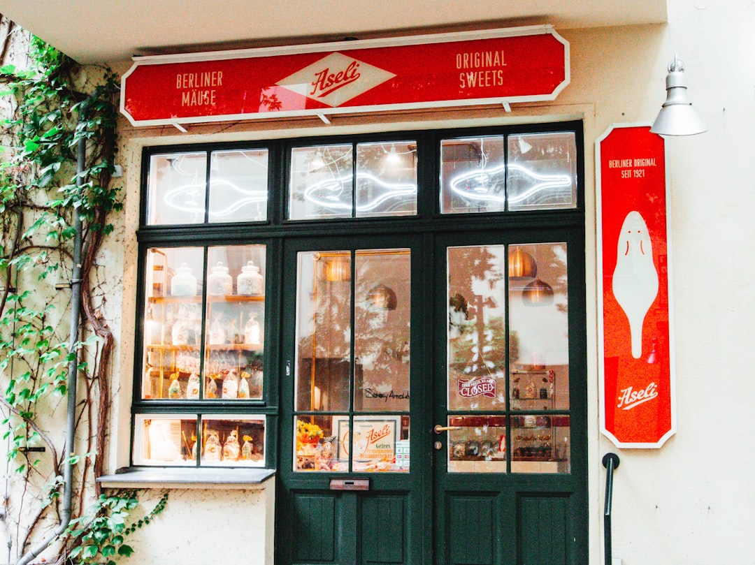 a store front with a red sign