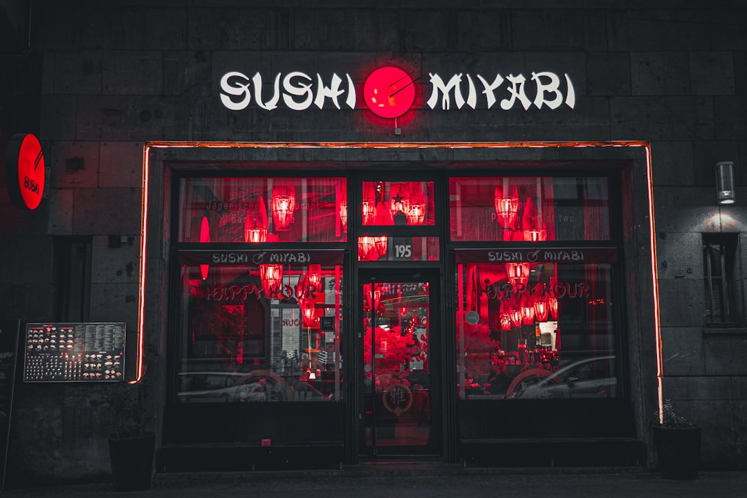Sushi miyabi restaurant glows with red neon lights.